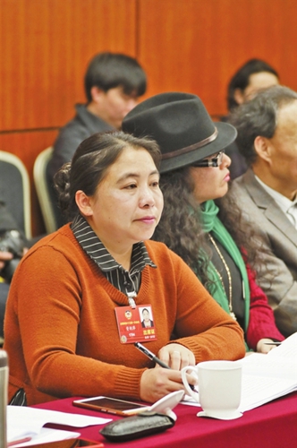 基诺族全国政协委员资艳萍:山乡绽放幸福微笑 基诺族全国政协委员资艳萍:山乡绽放幸福微笑